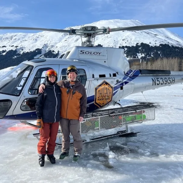 Paul Barendregt guiding his son on a heli-skiing trip.